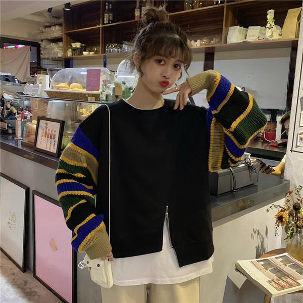 Modern női blúz színes ujjakkal és cipzárral