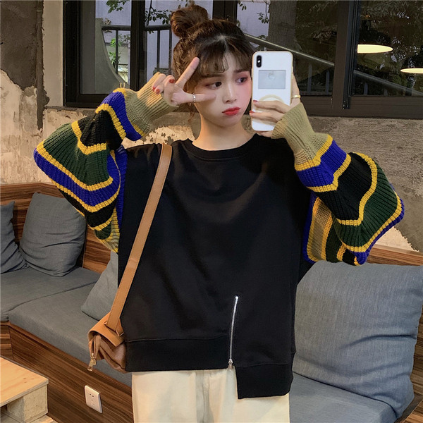 Modern női blúz színes ujjakkal és cipzárral