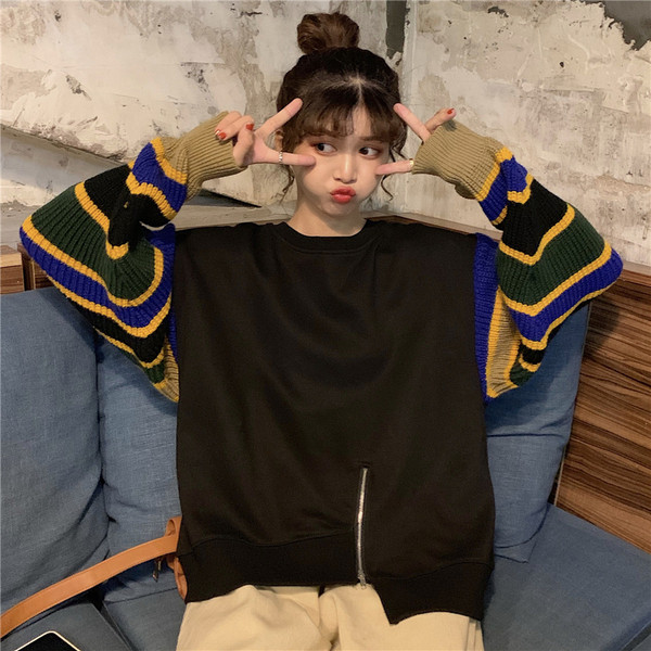 Modern női blúz színes ujjakkal és cipzárral