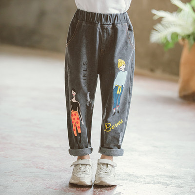 Blugi moderni pentru copii cu motive rupte si aplicatii in albastru si negru pentru fete