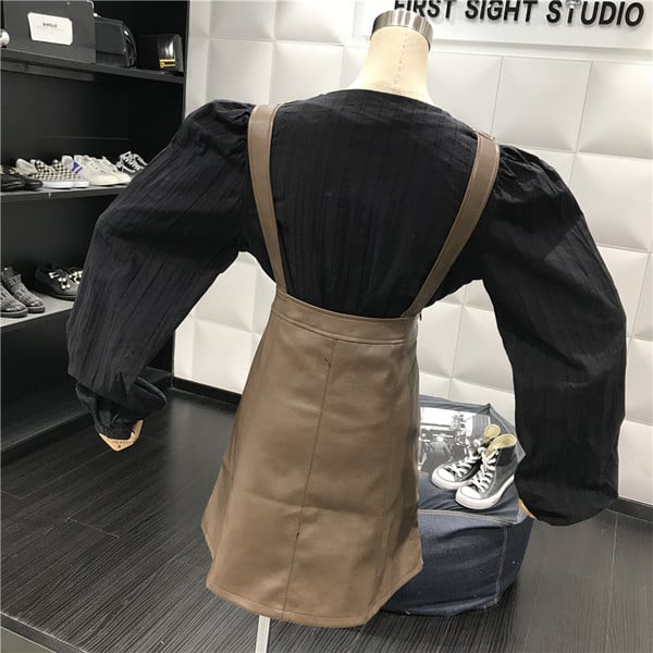 Модерен дамски сукман от еко кожа в черен и кафяв цвят