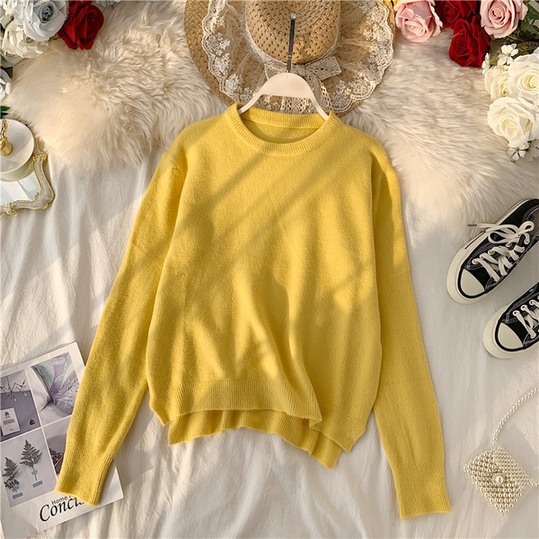 Modern női pulóver ovális nyakkivágással, aszimmetrikus mintával