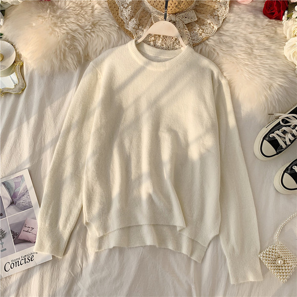 Modern női pulóver ovális nyakkivágással, aszimmetrikus mintával