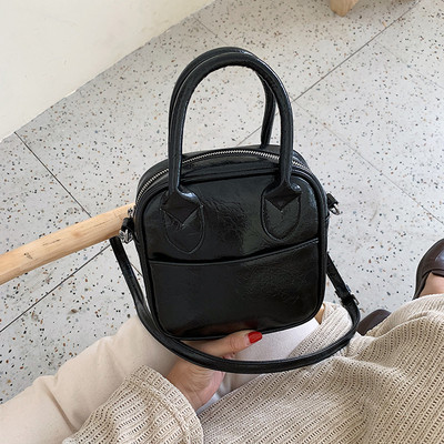 Μοντέρνα γυναικεία τσάντα με δύο  λαβές και φερμουάρ