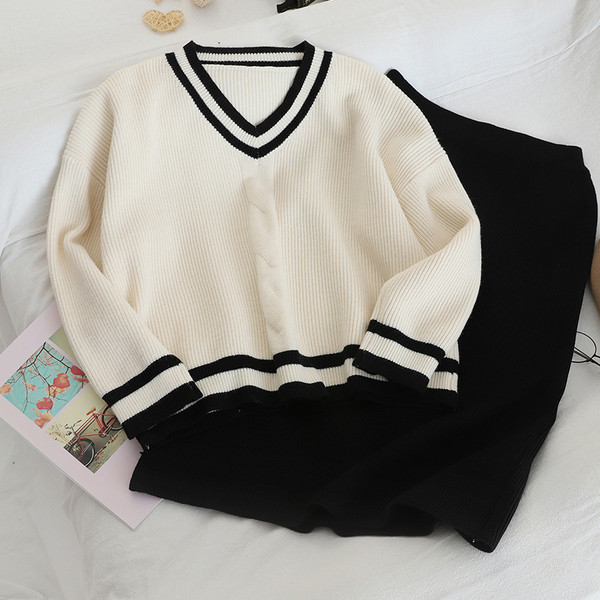 Női szett fekete és piros pulóvert és szoknyát tartalmaz