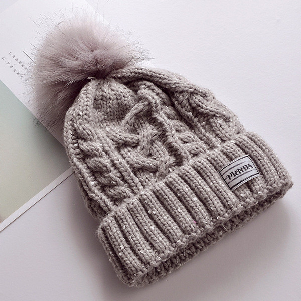 Női téli kötött sapka pehellyel több színben