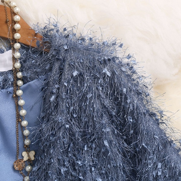 Új modell női kabát három színben bojttal, derékban övvel