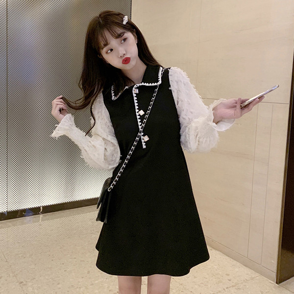 Női aktuális rövid ruha, hosszú ujjú fekete színben