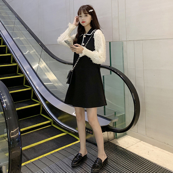 Női aktuális rövid ruha, hosszú ujjú fekete színben