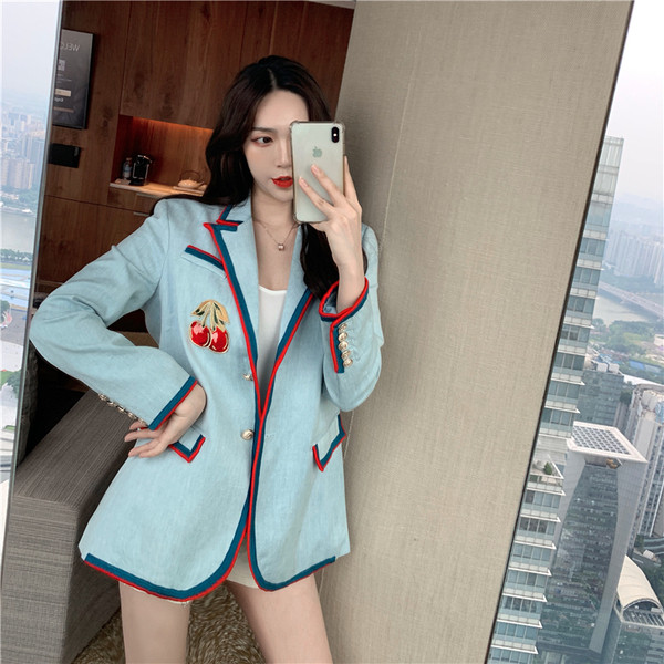 Modern női kabát, kék színű rátéttel