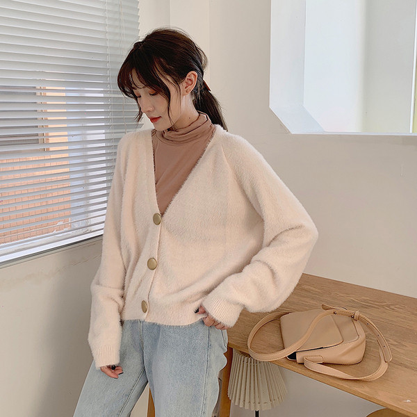 Modern női mellény két színben, gombokkal és spitz nyakkivágással