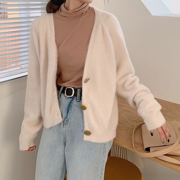 Modern női mellény két színben, gombokkal és spitz nyakkivágással