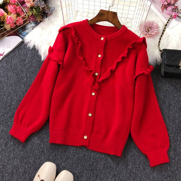 Női kardigán gombokkal és fürtökkel több színben