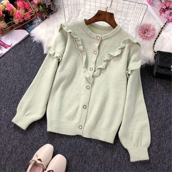 Női kardigán gombokkal és fürtökkel több színben