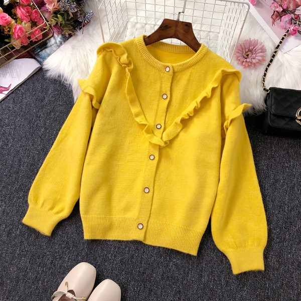 Női kardigán gombokkal és fürtökkel több színben