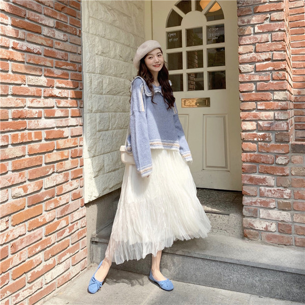 Női alkalmi kötött blúz ovális nyakkivágással, széles modellel