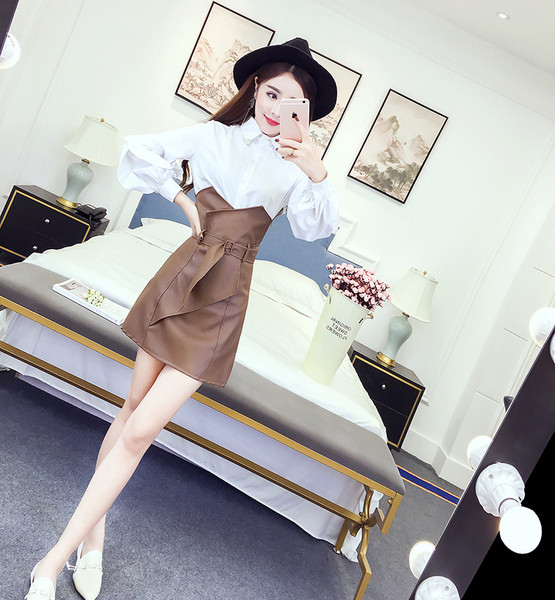 Stílusos női szoknya magas derékkal, fekete és barna övvel