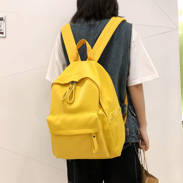 Női alkalmi hátizsák elülső zsebbel, négy színben