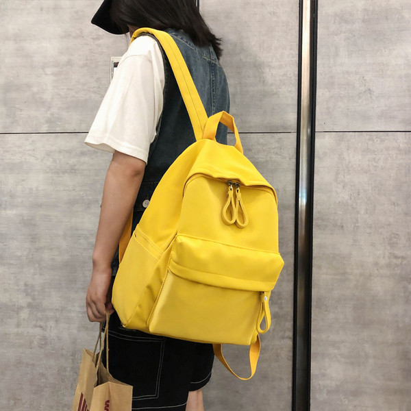 Női alkalmi hátizsák elülső zsebbel, négy színben