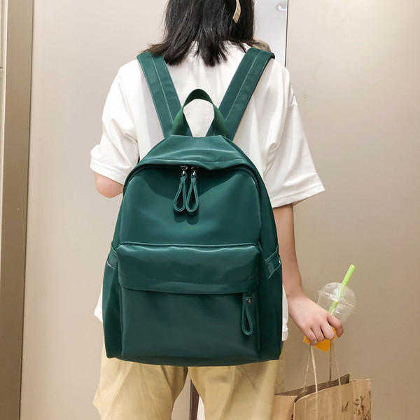 Női alkalmi hátizsák elülső zsebbel, négy színben