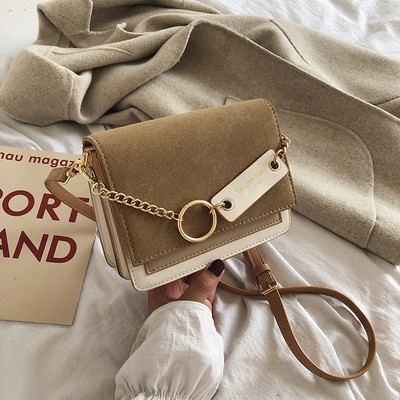 Modern női táska fém elemekkel, hosszú füllel, többféle színben