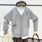 Szürke színű női kardigán gombokkal és zsebekkel