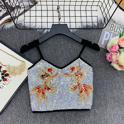 Modern női felső vékony pántokkal és flitterekkel