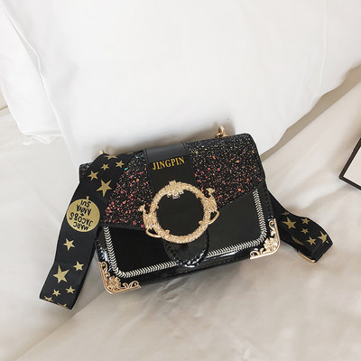 Stílusos női táska fényes részecskékkel és fém elemekkel négy színben