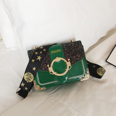 Stílusos női táska fényes részecskékkel és fém elemekkel négy színben