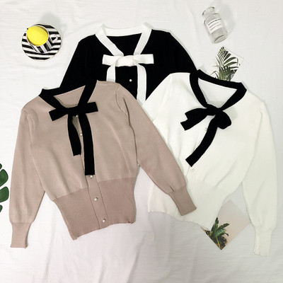 Κομψή γυναικεία ζακέτα με κορδέλα και κουμπιά σε μαύρο, λευκό και καφέ χρώμα