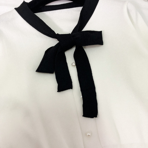 Vesta eleganta de dama cu panglica si nasturi in negru, alb si maro