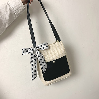 Női táska szalaggal és vállfogantyúval több színben