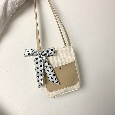 Női táska szalaggal és vállfogantyúval több színben