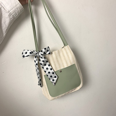 Női táska szalaggal és vállfogantyúval több színben