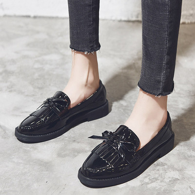 Stylish women`s moccasins with fringe in black and burgundy