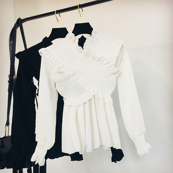 Női téli blúz fehér és fekete színben