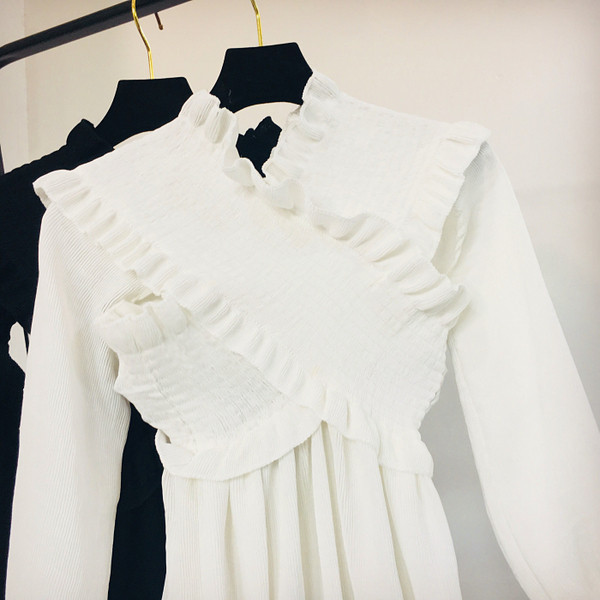 Női téli blúz fehér és fekete színben