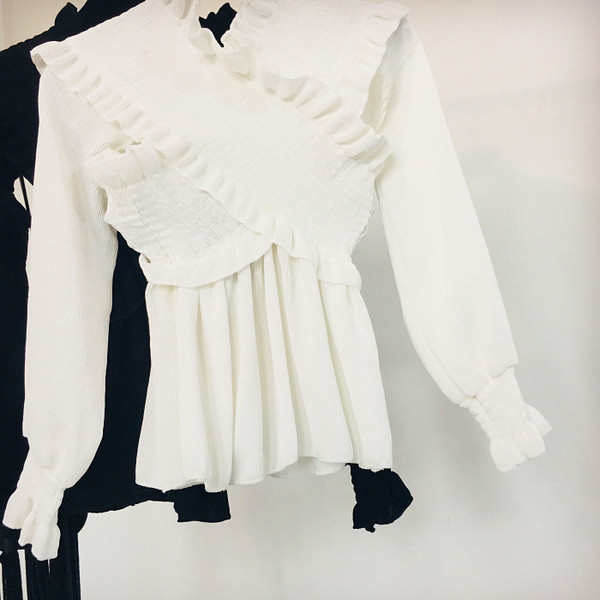 Női téli blúz fehér és fekete színben