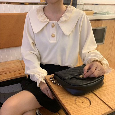 Női blúz ovális nyakkivágással fehér és fekete színben, gombokkal