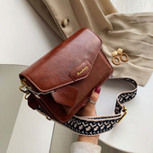 Női táska hosszú füllel fekete, kék, zöld és barna színekben