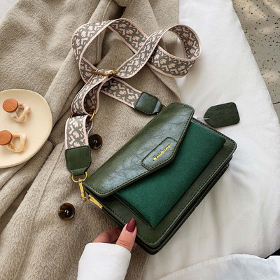 Női táska hosszú füllel fekete, kék, zöld és barna színekben