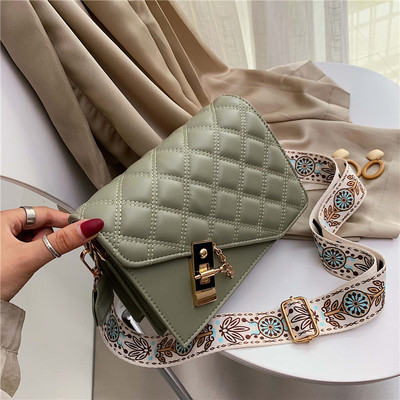 Modern női táska hosszú mintás fogantyúval, fém elemekkel