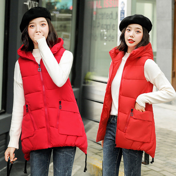 Aszimmetrikus női mellény modell zsebekkel, több színben