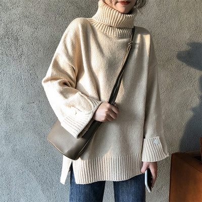 Női aktuális széles pulóver három színben, gombokkal