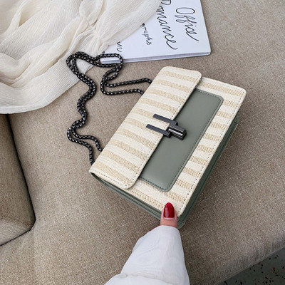 Μοντέρνα γυναικεία τσάντα με μεταλλικό συνδετήρα και μεγάλη λαβή