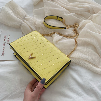 Geanta de dama eleganta cu elemente metalice si maner lung in galben, alb si negru