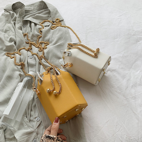 Alkalmi női táska fém elemekkel, sárga, fekete, zöld, kék és fehér színben