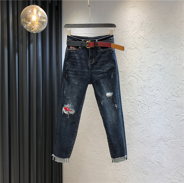 Alkalmi női hosszú farmernadrág magas derékkal, szakadt motívummal