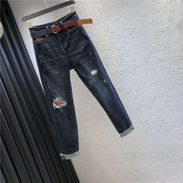 Alkalmi női hosszú farmernadrág magas derékkal, szakadt motívummal