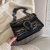 Geanta de dama moderna cu element metalic si maner lung in mai multe culori